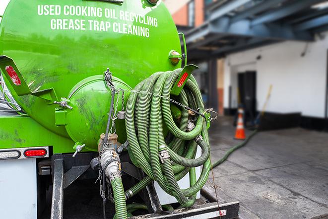 a service truck pumping grease from a restaurant's grease trap in Alvada OH